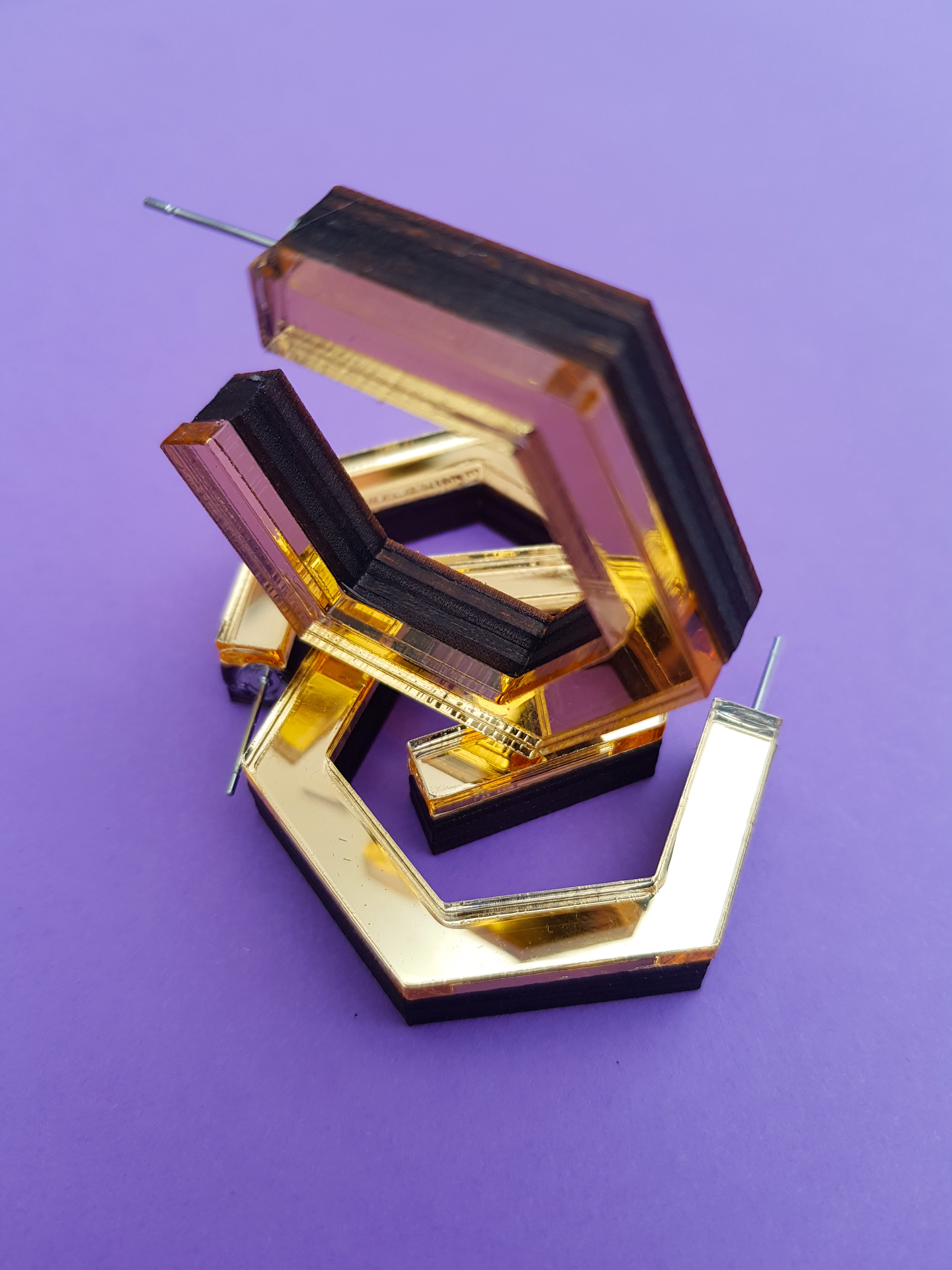 Gold hexagonal ply and perspex hoop earrings